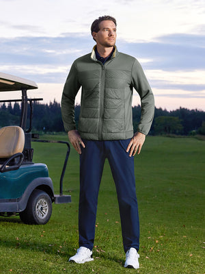 Model posing with hands on hips on course, wearing golf fleece winter puffer jackets in agave green