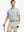 Model wearing Modern Texture Stylish Polo in LIGHT GREY, front half-body view holding golf club.