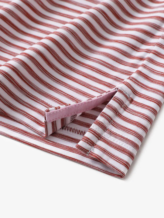 Hem slit detail on BRICK WHITE polo highlighting the painterly stripe effect and soft structure