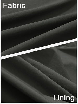 Close-up texture of dark grey women's stretch a-line golf skort with 7 pockets fabric showing detailed outer and inner lining material.