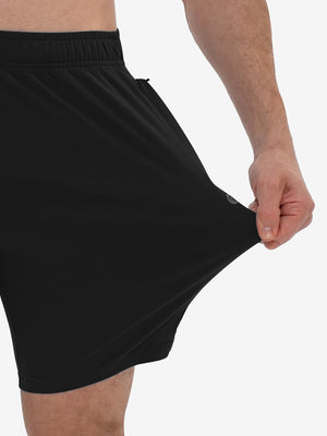 View showing loose fit of black breathable running shorts with 4 zipper pockets