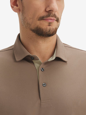 Front view from nose to chest of model wearing the light brown ventilated pique performance polo, showcasing the upper fit