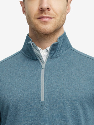Front view from nose to chest of model wearing colony blue melange moisture wicking quarter zip pullover