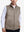Front upper body shot of model wearing gray brown  classic micro suede leather puffer vest