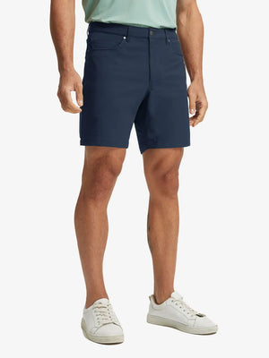 NAVY 4-way Stretch Performance Solid Shorts, golfer front lower body with club, 7 Inch view