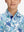 Close-up: nose to chest in sea turtle performance print boys golf polo.
