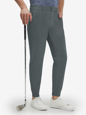 Front lower body shot of model wearing dark grey flat front golf joggers pants with belt loops