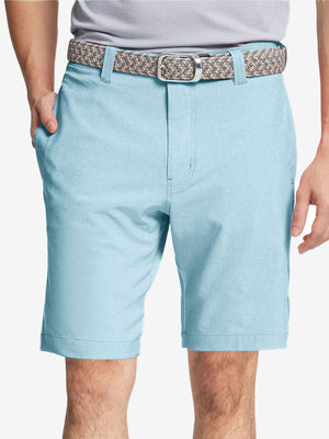Front view of youth wearing sky blue Heather Performance Golf Shorts, showing fit and style