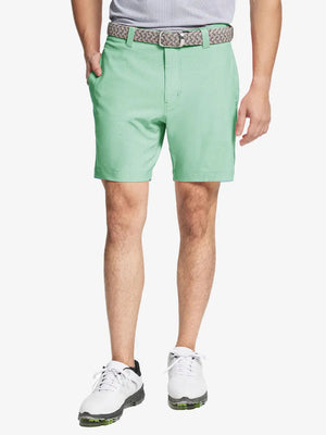 MINT GREEN 7 Inch Heather Performance Golf Shorts with front view, model's lower body and side pockets visible