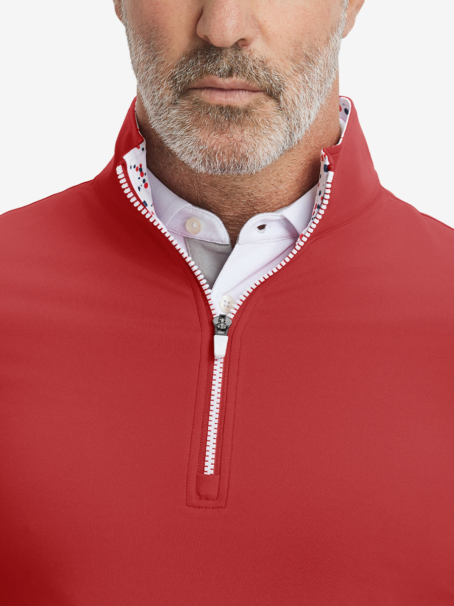 Close-up from nose to chest, showing collar and zipper detail of the red golf pullover.