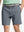 Front view of youth wearing navy Heather Performance Golf Shorts, showing fit and style