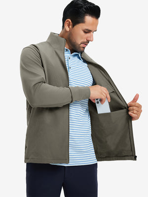 Model wearing water-resistant zip up golf jacket, dark khaki, front upper-body with one hand in pocket.