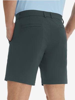 Back lower body view of model wearing the iron grey stretch soft flat front dress golf shorts, highlighting the rear design