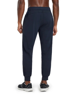 Back lower body view of model wearing NAVY Performance Tapered Sports Joggers