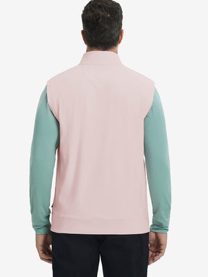 Back upper body view of the light pink print collar quarter zip golf vest, clean cut and relaxed posture.