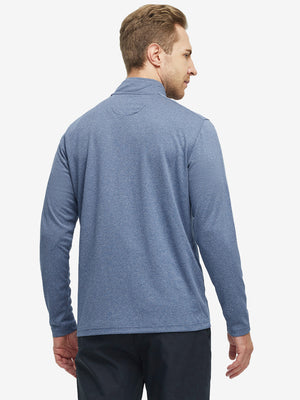 Back waist-up shot of model wearing saxony blue melange moisture wicking quarter zip pullover