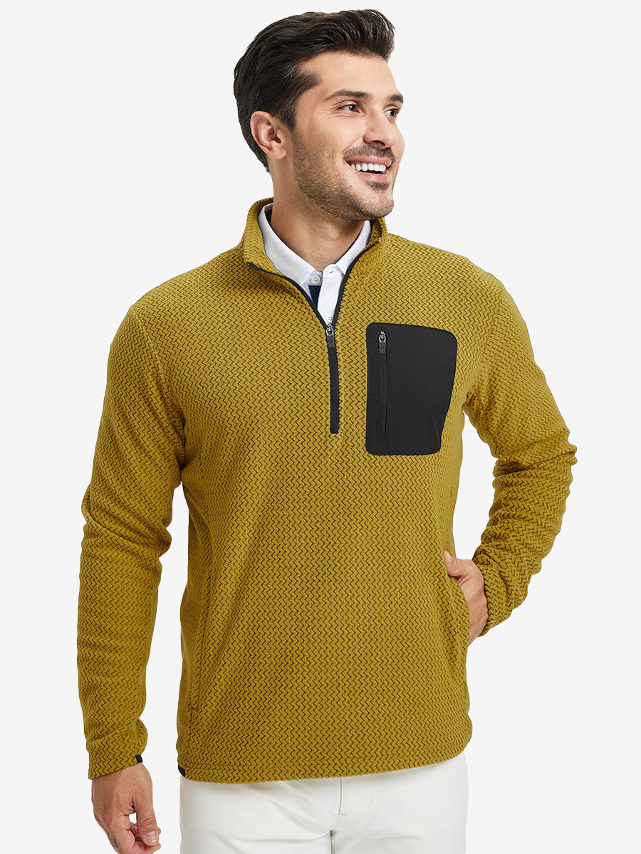 Model with one hand in side pocket, wearing midweight warm stretchy quarter zip pullover in yellow.