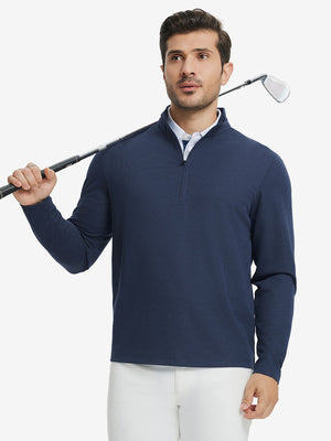 Full body model holding golf club in Premium jacquard quarter zip pullover, dark blue style