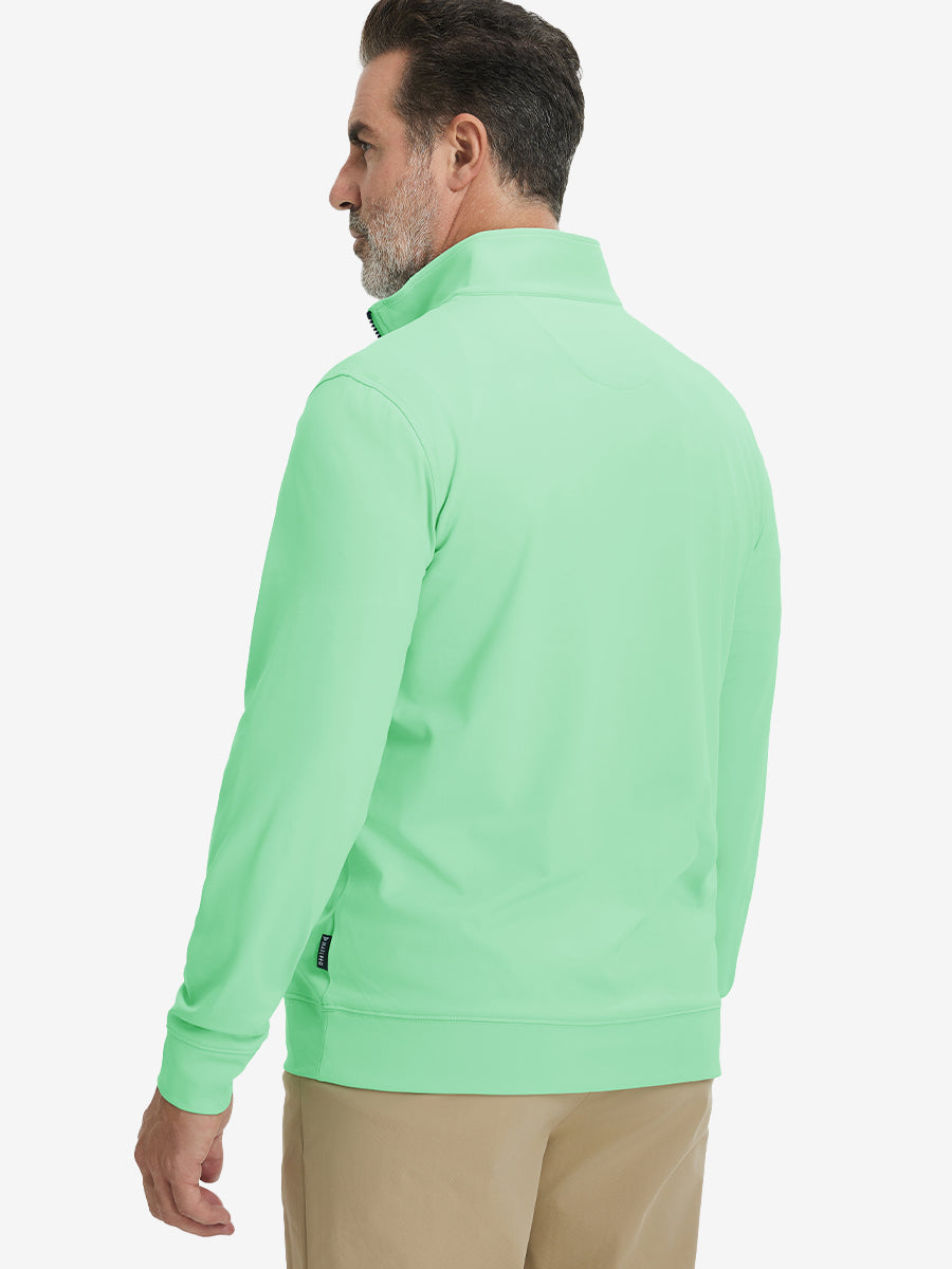 Back upper body view of the light green lightweight golf pullover, model turns head slightly with ease.