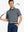 Front half-body shot holding a golf club in Navy Grey Yarn Dyed Stripe Polo – clean, confident look