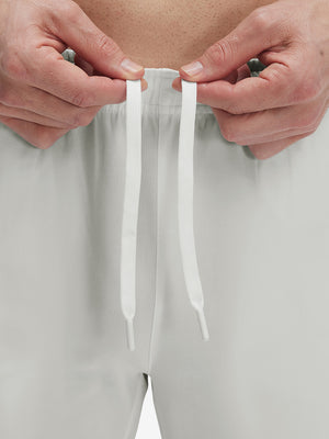 Close-up of elastic waistband on khaki grey superion softness mesh joggers with zipper pockets