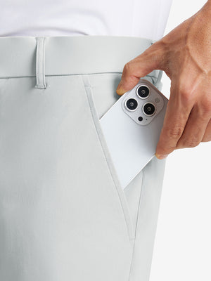 iPhone placed inside pocket of the Glacier Grey Quick Dry Casual Shorts, showing storage space.