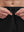 Detail view of elastic waistband on black breathable running shorts with 4 zipper pockets