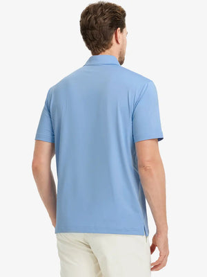 Rear half-body view of Everyday Solid Jersey Polo in LIGHT BLUE, showcasing neat back fit.