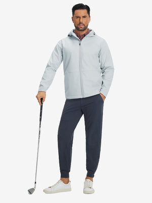 Model holding a golf club, wearing light gray reflective hooded softshell jacket in full-body view.