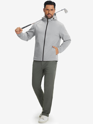 Model holding a golf club, wearing light grey water-resistant heat-tech softshell winter jacket with hood.