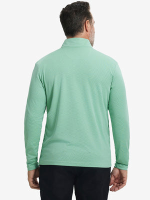 Back upper view of model wearing jacquard quarter zip pullover in light green, showing clean seam lines.