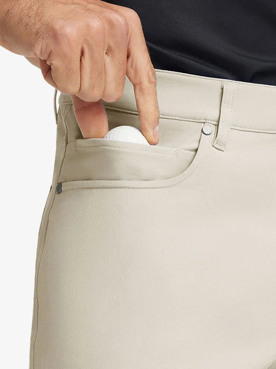 LIGHT KHAKI 4-way Stretch Performance Solid Shorts, front pocket holding golf ball detail, 7 Inch
