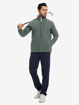 Model holding a golf club, wearing slate green water-resistant zip up golf jacket in full-body view.