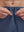 Detail view of elastic waistband on misty blue breathable running shorts with 4 zipper pockets