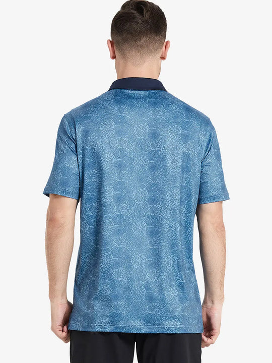 Back view of the model wearing the midnight fireworks pattern polo, blending festive and sporty vibes.