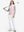 Model holding golf club full body, women's lightweight slim-fit puffer vest styled in sporty light pink