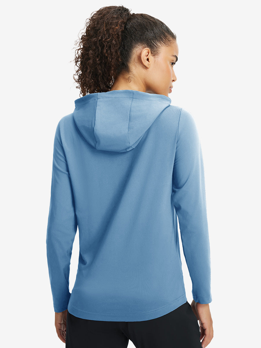 Back upper view of model in women's lightweight hoodies pullover, showing relaxed fit in misty blue.