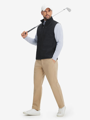 Full-body shot of model holding golf club while wearing sleeveless softshell fleece outdoor vests with 6 pockets in black