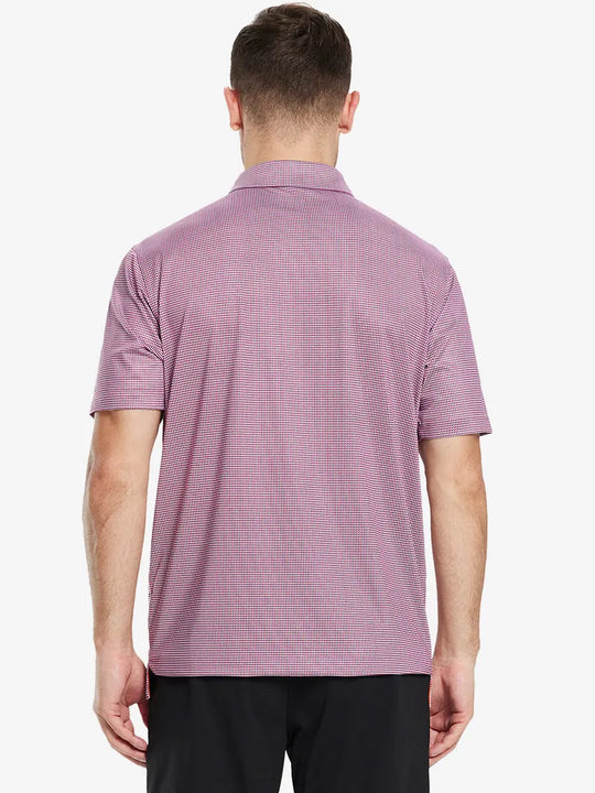 From the back, the model shows the back design of the RED PUZZLE BLOCK Polo shirt, clearly showing the shape and cut of the garment