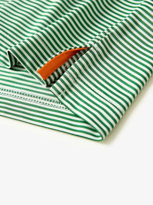 Zoomed-in look at the split hem of the Cooling Stripe Golf Shirt in EMERALD STRIPE, showing smooth stitching