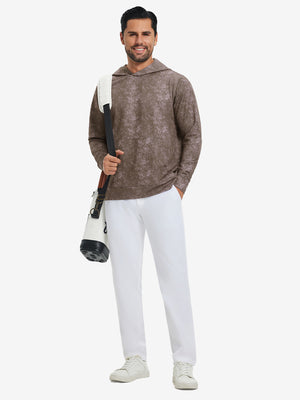 Model carrying a golf bag while wearing exclusive print kangaroo hoodies in grey brown, full-body shot.