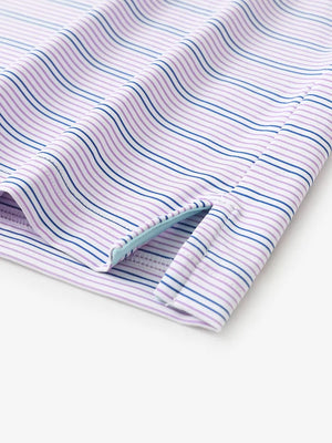 Close-up of side hem slit on Pinkish Purple Cobalt Stripe Performance Stripe Golf Shirt