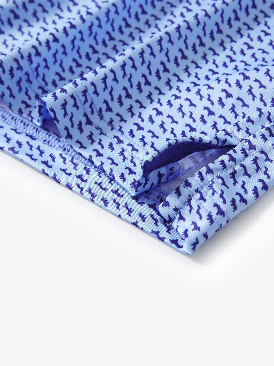 Detail view of the blue navy dogs pattern polo shirt, showcasing the refined hem opening and high-quality stitching.