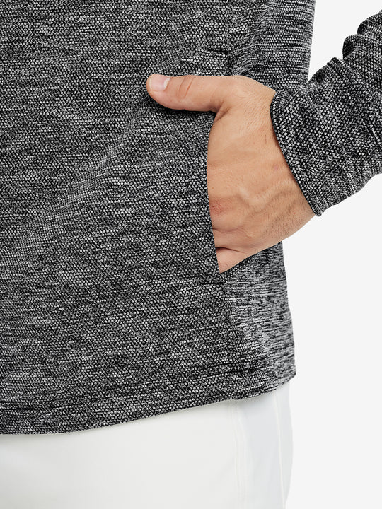 Close-up of pocket detail, single hand inside texture solid hoodies pullover, casual style in black heather.