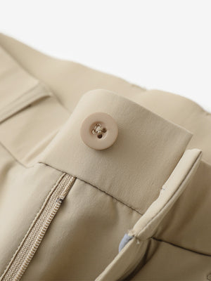 Waist detail of quick dry casual dress pants in khaki, featuring button and zipper design.