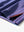 Close-up of side hem slit on PLUM BLUE STRIPE polo, detailing for comfort and mobility