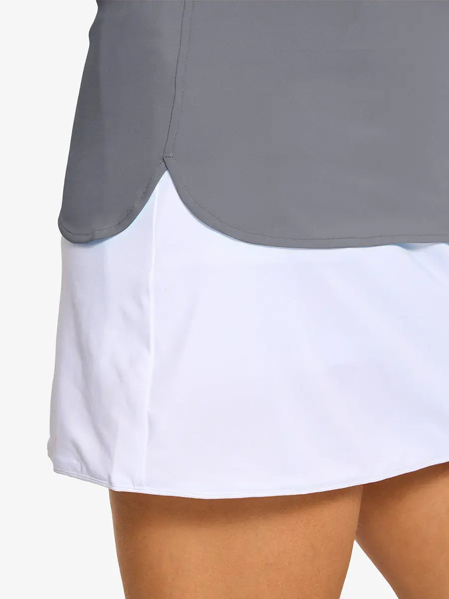 Detail shot of side hem opening on LIGHT GREY Women's Performance Solid Polo
