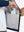 Hand placing an iPhone into pocket of water-resistant heat-tech softshell winter jacket with hood.