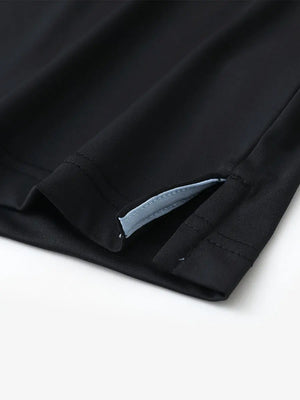 Close-up of side slit detail on BLACK1 Chest Print Polo Shirts