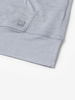 Hemline detail of the Quarter Zip Hoodie in Faded Denim Heather, showing neat edges and fine craftsmanship.